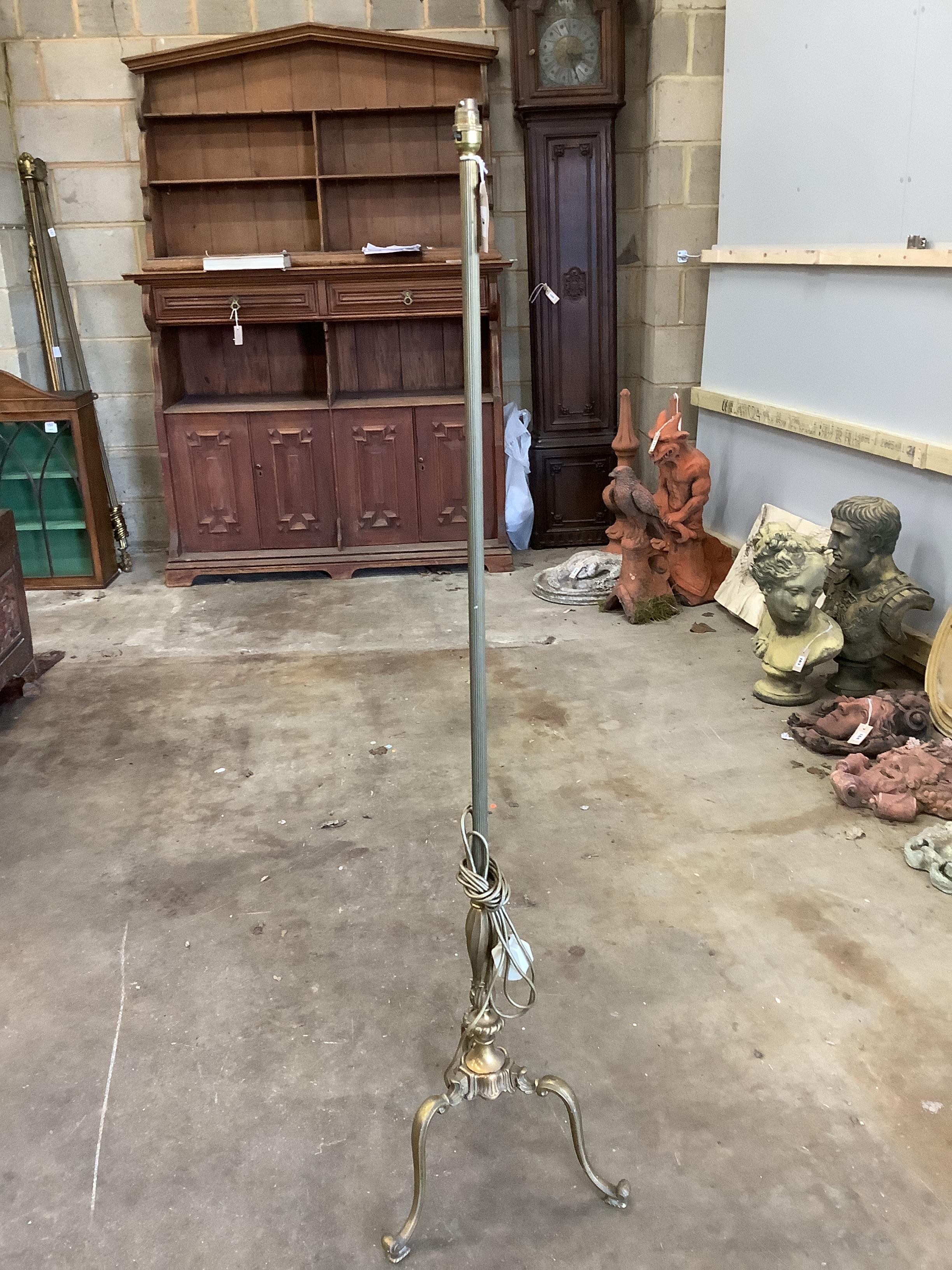 A carved pine standard lamp, height including shade 180cm, together with a smaller gilt metal standard lamp